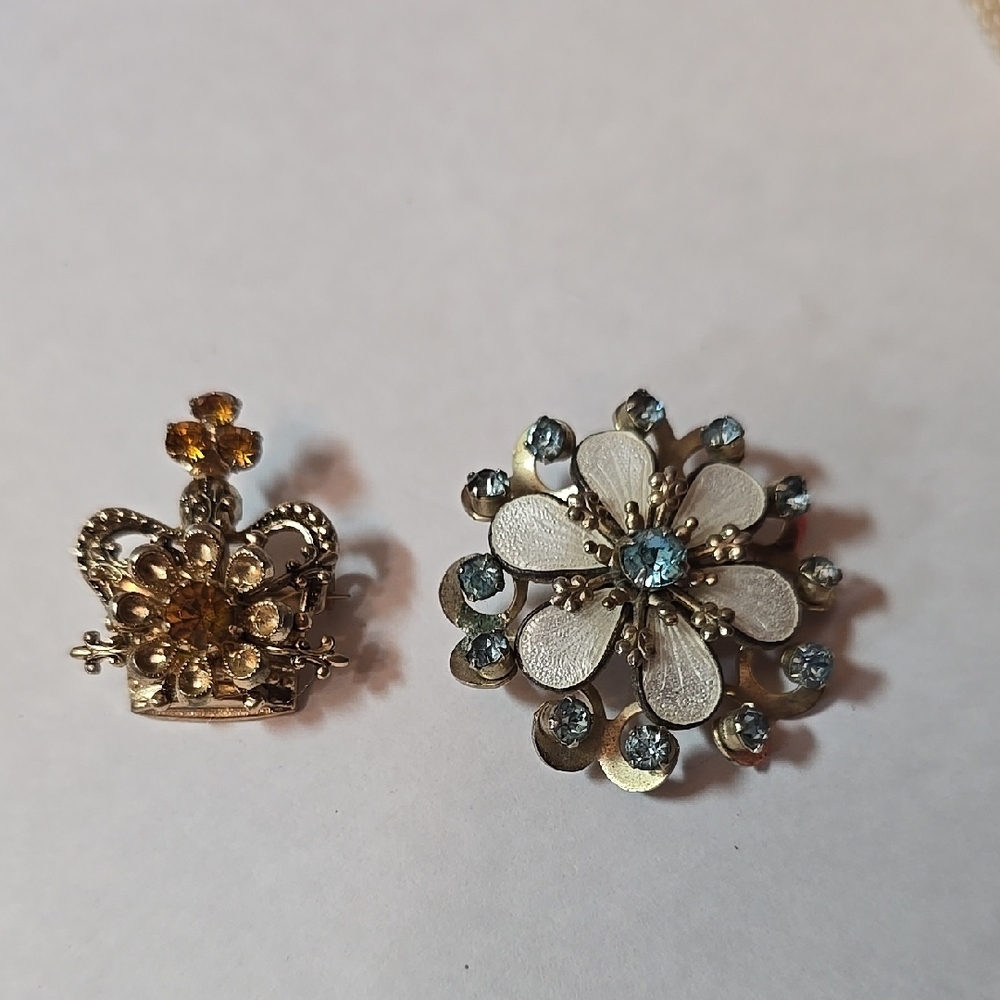 Gold crown w/ amber glass and Blue Brooch with blue rhinestones & cream enamel.